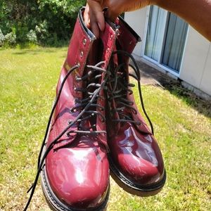 Crimson lace up wellie boots.